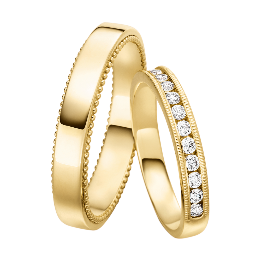 Verlobungsring aus poliertem Gelbgold mit Brillanten in Kanalfassung und feiner Perlierung als Symbol ewiger Liebe