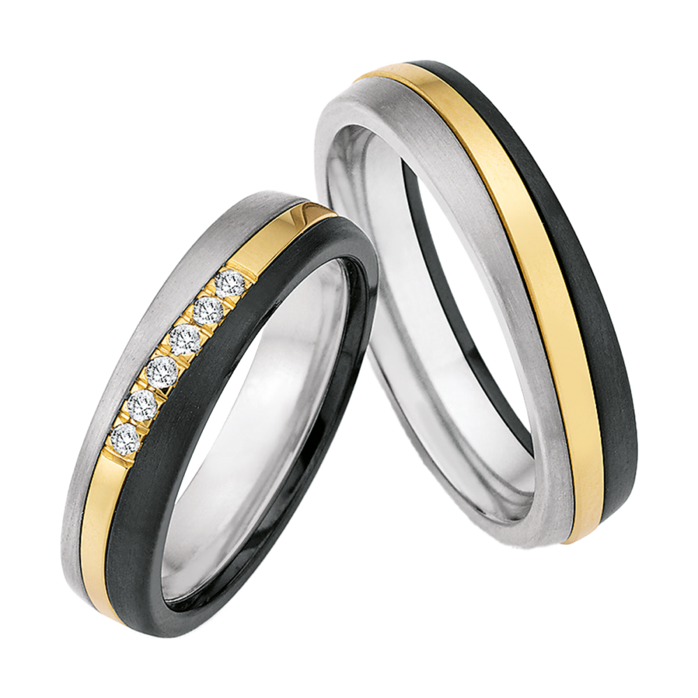 Tricolor-Trauringe aus Titan, Zirconium und Gold mit wellenförmigem Design und mittig gefassten Diamanten im Brillantschliff