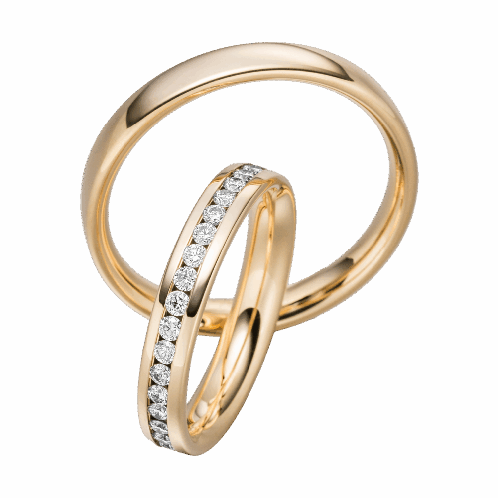 Glänzende Gelbgold-Trauringe mit durchgehender Brillantreihe im edlen Design