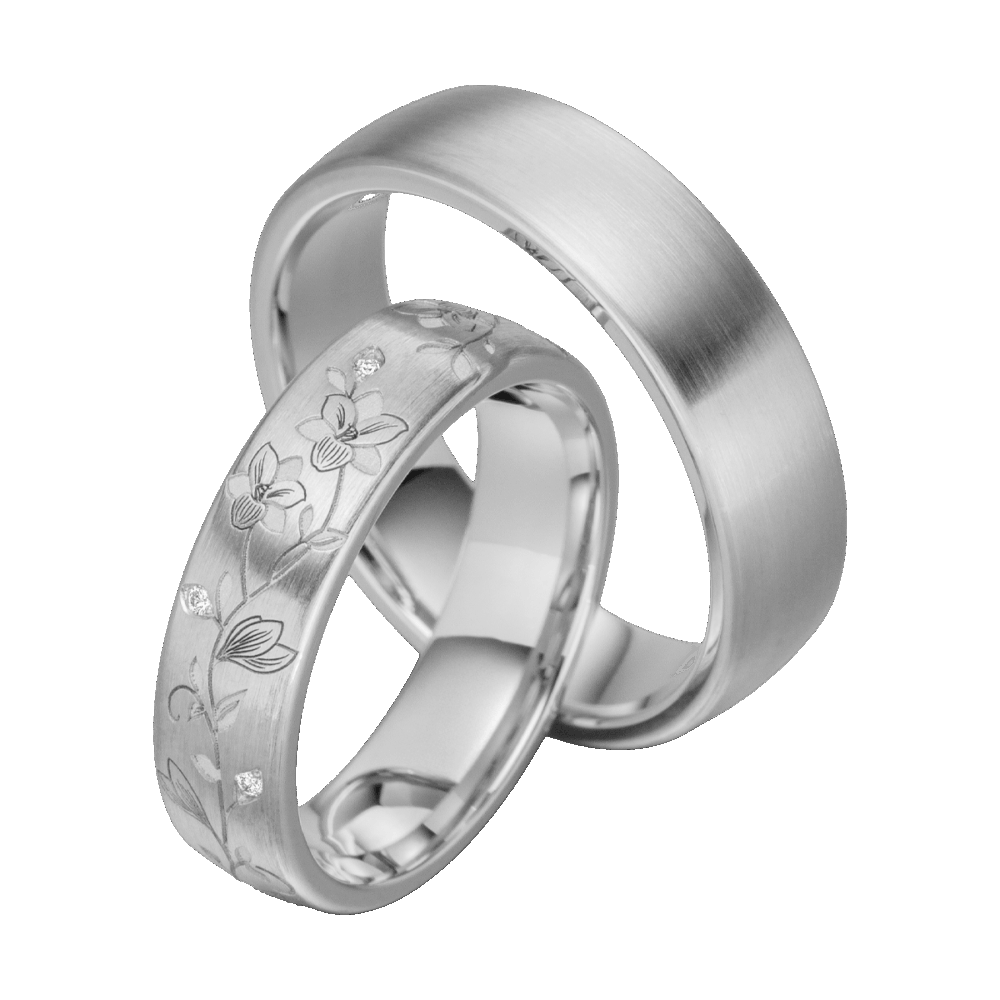 Hochwertige Eheringe aus Platin mit filigranen Blütenmotiven und eingefassten Diamanten