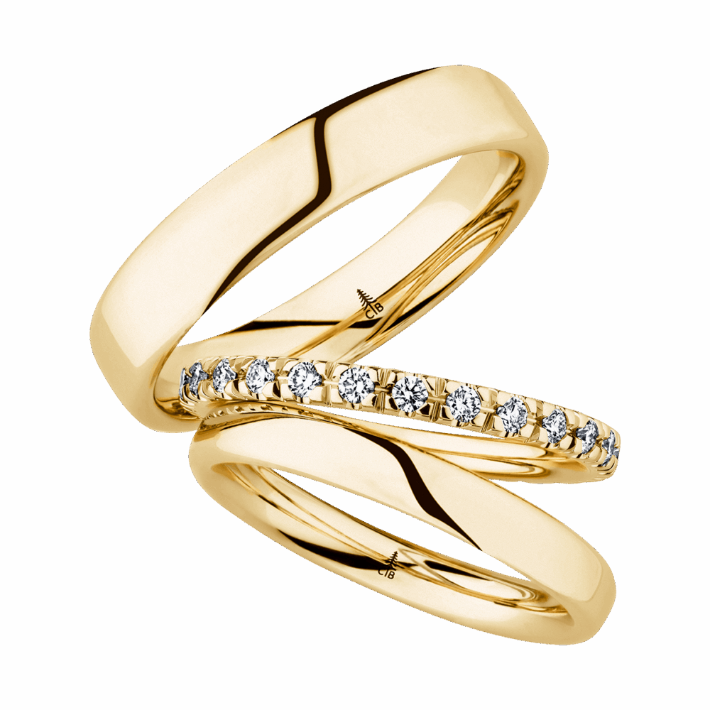 Gelbgoldene Trauringe mit strahlendem Brillantbesatz – Symbol ewiger Liebe und Wärme