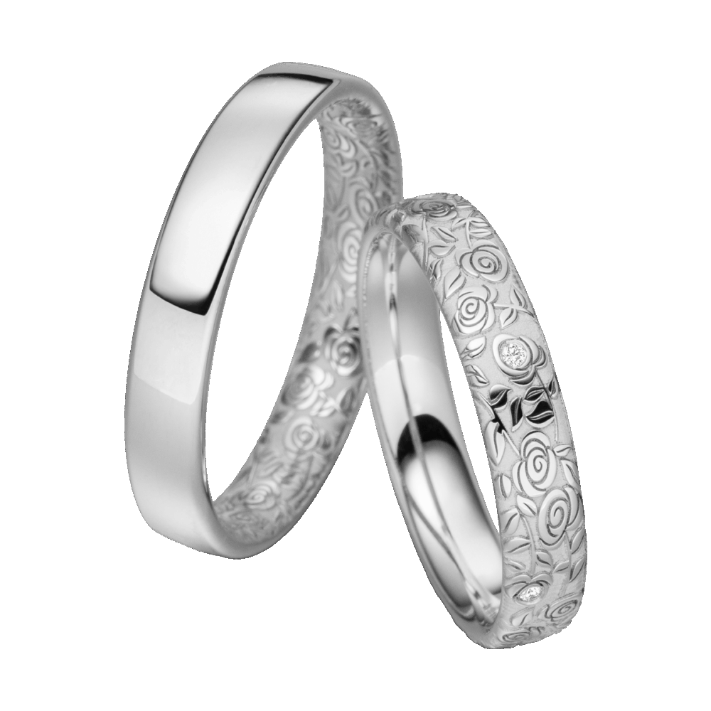 Platinring mit sandmatter Struktur, filigraner Rosenverzierung und dezenten Brillantakzenten