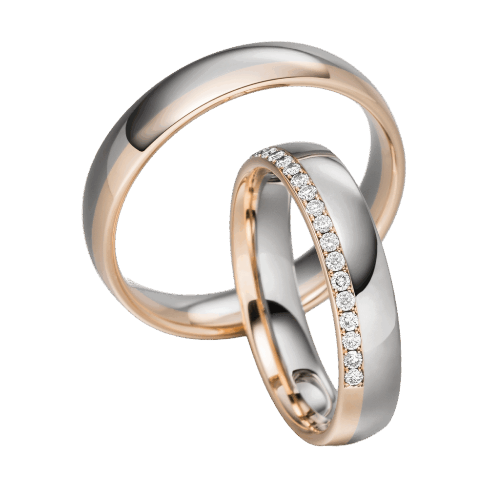 Bicolor-Trauringe aus Weißgold und Roségold mit polierter Oberfläche und funkelnden Diamanten im Damenring