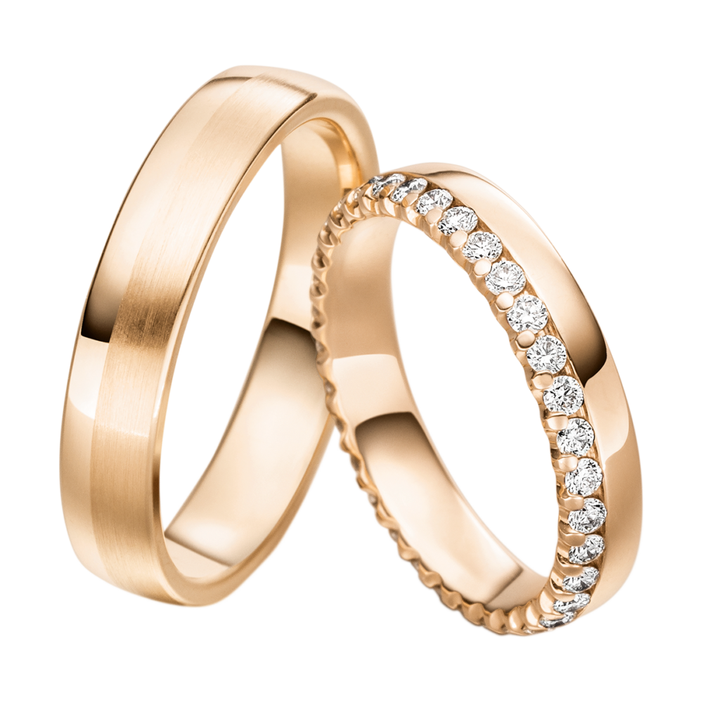 Handgefertigte Rotgold Trauringe aus der Davinél Kollektion mit funkelnden Brillanten
