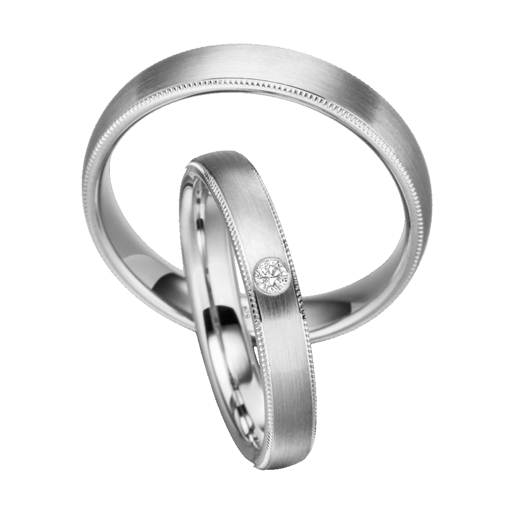 Platin-Trauring mit sanft mattierter Oberfläche, eleganter Millegriff-Struktur und Brillantbesatz